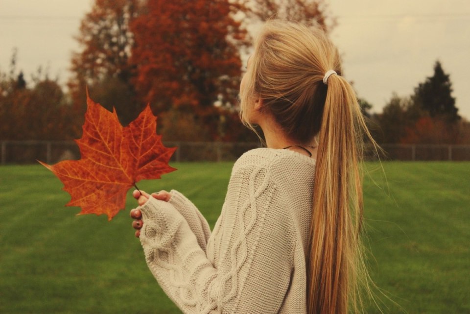 Young Woman Enjoying Autumn Leaves in a Park Surrounded by ...