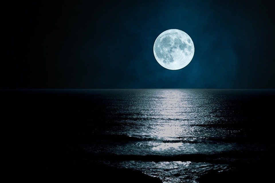 Full Moon Over Ocean at Night